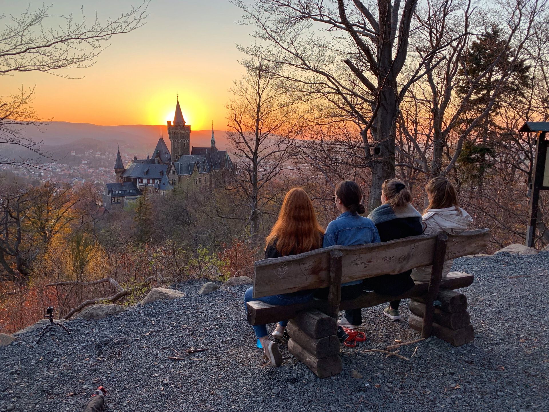 Exchange students in Germany looking at the sunset behind the castle
