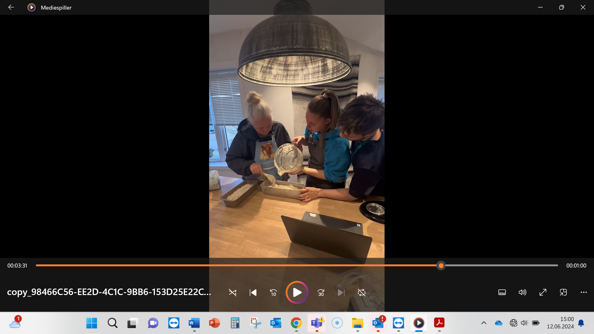 Screenshot of students at work in their own home kitchen.
