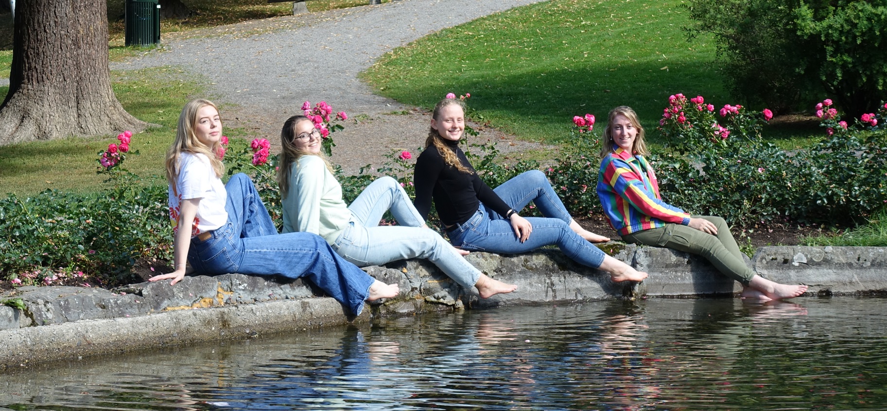 Exhange students posing by the fountain in the park